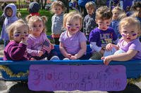 Military children pose for a photo during the Military Child Parade at Barksdale Air Force Base