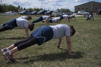 Team Minot airmen participate in physical training at Minot Air Force Base, North Dakota.