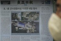 newspaper showing file images of the Sohae Satellite Launching Station in Tongchang-ri, North Korea