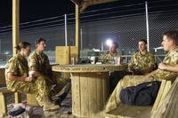 British Army and Royal Air Force personnel relax with coffees and conversation at Kandahar, Afghanistan.