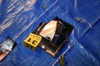 This image, contained in the Justice Department motion for continued pretrial detention of Jack Teixeira, shows electronic items recovered from a dumpster at his mother and stepfather's home in North Dighton, Mass.