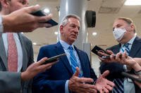 Sen. Tommy Tuberville, R-Ala., a member of the Senate Armed Services Committee, talks to reporters in an interview about his blockade of military nominees, at the Capitol in Washington.
