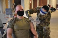 Soldier receives a COVID-19 vaccination
