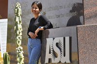 Fahima Sultani stands at the entrance of Arizona State University