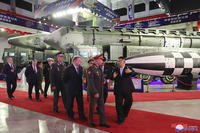 North Korean leader Kim Jong Un, right, with Russian delegation led by its Defense Minister Sergei Shoigu
