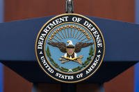 The seal of the Department of Defense is seen on the podium at the Pentagon