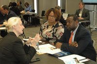 A small-business owner presents her company’s capabilities to Jennifer Letson and Thaddeus Martin, both of the Aviation and Missile Command’s Office of Small Business Programs, at Redstone Arsenal, Ala.