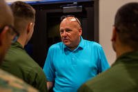 The manager of talent acquisition and veteran affairs with Pike Corporation speaks to U.S. Marines at the Aviation Job Fair on Marine Corps Air Station New River in Jacksonville, N.C.