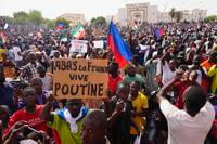 Nigeriens participate in a march called by supporters of coup leader Gen. Abdourahmane Tchiani in Niamey
