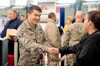 Airman 1st Class Beknazar Zhumabaev, 436th Logistics Readiness Squadron vehicle operator, meets with potential employers at a job fair during the Transition Summit at Dover Air Force Base, Del. 