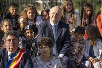NATO Deputy Secretary General Mircea Geoana sits with children