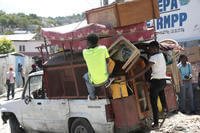 Residents flee their homes to escape clashes between armed gangs in the Carrefour-Feuilles district of Port-au-Prince, Haiti.