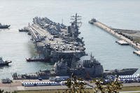 U.S. nuclear-powered aircraft carrier USS Ronald Reagan is escorted as it arrives in Busan