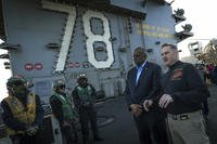 Secretary of Defense Lloyd J. Austin III tours the flight deck of USS Gerald R. Ford (CVN 78) with Ford Commanding Officer Capt. Rick Burgess.