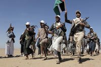Houthi fighters march during a rally of support for the Palestinians in the Gaza Strip and against the U.S. strikes on Yemen outside Sanaa