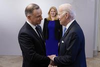 President Joe Biden, right, is greeted by Polish President Andrzej Duda