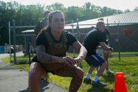 U.S. Marine Corps Staff Sgt. Lili Diaz conducts squats during a Murph Workout-style physical training exercise on Marine Corps Base Quantico, Virginia, May 26, 2023. ‘The Murph,’ named in honor of Medal of Honor recipient and Navy Seal LT. Michael P. Murphy, was started in remembrance of Murphy after he was killed in action in June 2005. (Cpl. Devin Horton/U.S. Marine Corps photo) U.S. Marine Corps Staff Sgt. Lili Diaz conducts squats during a Murph Workout-style physical training exercise on Marine Corps Base Quantico, Virginia.