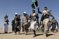 Houthi fighters march during a rally of support for the Palestinians in the Gaza Strip and against the U.S. strikes on Yemen