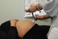 A U.S. Army Certified Nurse Midwife measures baby's heart rate
