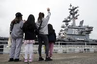 Family members see off the aircraft carrier USS Ronald Reagan