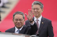 Chinese Premier Li Qiang waves to media members