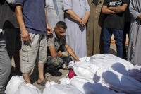 Palestinians mourn relatives killed in the bombardment of the Gaza Strip