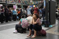 A traveler waits inside the Gare du Nord train station