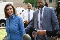 Rep. Nancy Pelosi, D-Calif., the speaker emerita, left, arrives at the Democratic National Headquarters