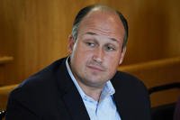 Nick Langworthy, chair of the New York State Republican Committee, listens