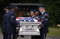 Airman Roger Fortson's casket is carried