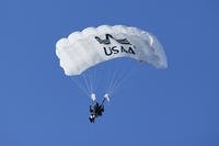 A member of the USAA parachute team flies down towards the field