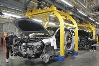 A worker assembles an SUV at a car plant of Li Auto, a major Chinese EV maker, in Changzhou