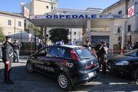 Italian paramilitary police officers stand outside a hospital in Italy.