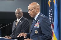 Chairman of the Joint Chiefs of Staff Gen. CQ Brown Jr., speaks with Defense Secretary Lloyd Austin