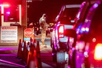 Patrolman checks a visitor’s base-access pass at Joint Base San Antonio-Lackland