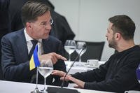 NATO Secretary General Mark Rutte, left, speaks with Ukraine's President Volodymyr Zelenskyy