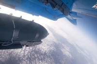 An Su-34 bomber of the Russian air force drops bombs on Ukrainian.