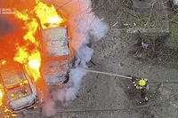 Emergency services personnel work to extinguish a fire in Ukraine.