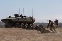 U.S. Marines dismount an amphibious combat vehicle.