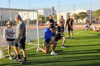 Combined Special Operations Joint Task Force-Levant (CSOJTF-L) service members perform lunges during group physical training.