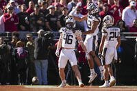 Navy fullback Alex Tecza celebrates his touchdown run