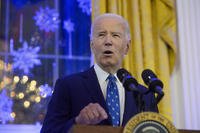 President Joe Biden speaks during a Hanukkah reception in the East Room of the White House