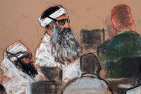 Khalid Sheikh Mohammed, center, and co-defendant Walid Bin Attash, left