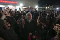 Palestinians celebrate the announcement of a ceasefire deal