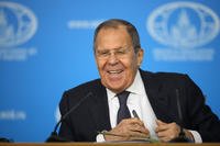 Russian Foreign Minister Sergey Lavrov smiles during his annual news conference in Moscow, Russia