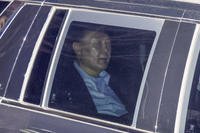 Impeached South Korean President Yoon Suk Yeol, sits in a car as he heads to a detention center