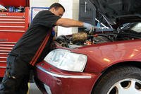 Alejandro Soto, 100th Force Support Squadron auto hobby shop technician from McFarland, Calif., adds battery water at the auto hobby shop on RAF Mildenhall, England.