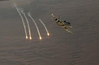 U.S. Navy EA-18G Growler fires flares during an Operation Inherent Resolve mission