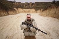 Ukraine soldier holds a rifle during military training near Kyiv, Ukraine.