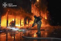 In this photo provided by the Ukrainian Emergency Service, firefighters put out the fire